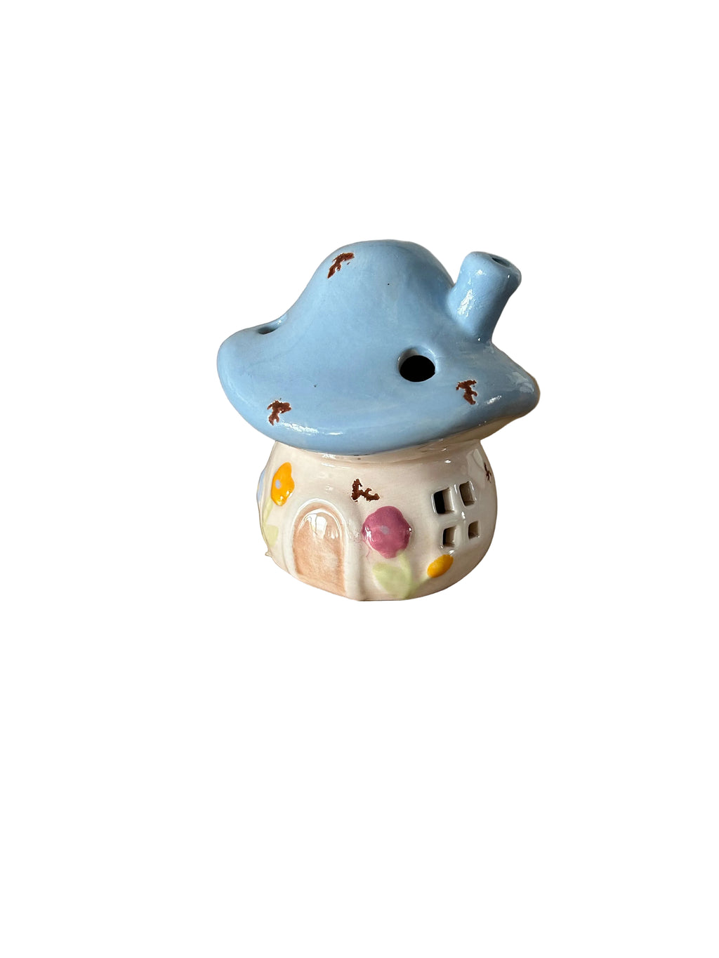 Small ceramic mushroom house with a blue cap on a white background