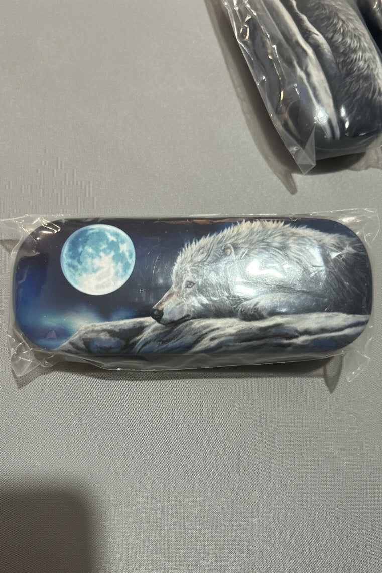 Wolf and moon design on a glasses case with another case 